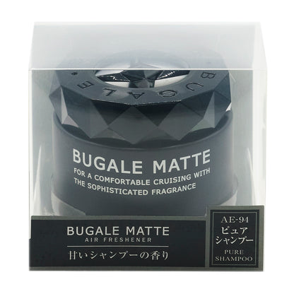 透明ケースに入った黒い容器の化粧箱の正面。BUGALE MATTE、FOR A COMFORTABLE CRUISING WITH THE SOPHISTICATED FRAGRANCE の表示。下の帯に BUGALE MATTE AIR FRESHENER「甘いシャンプーの香り」と、AE-94 ピュアシャンプー PURE SHAMPOO のラベル